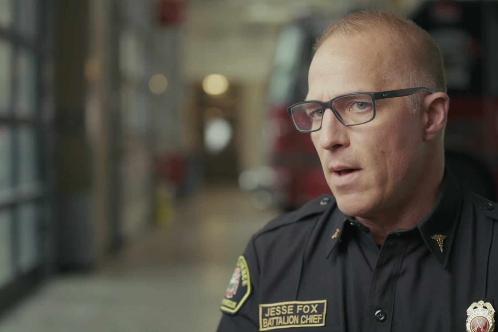 A man in a fire department uniform with a 